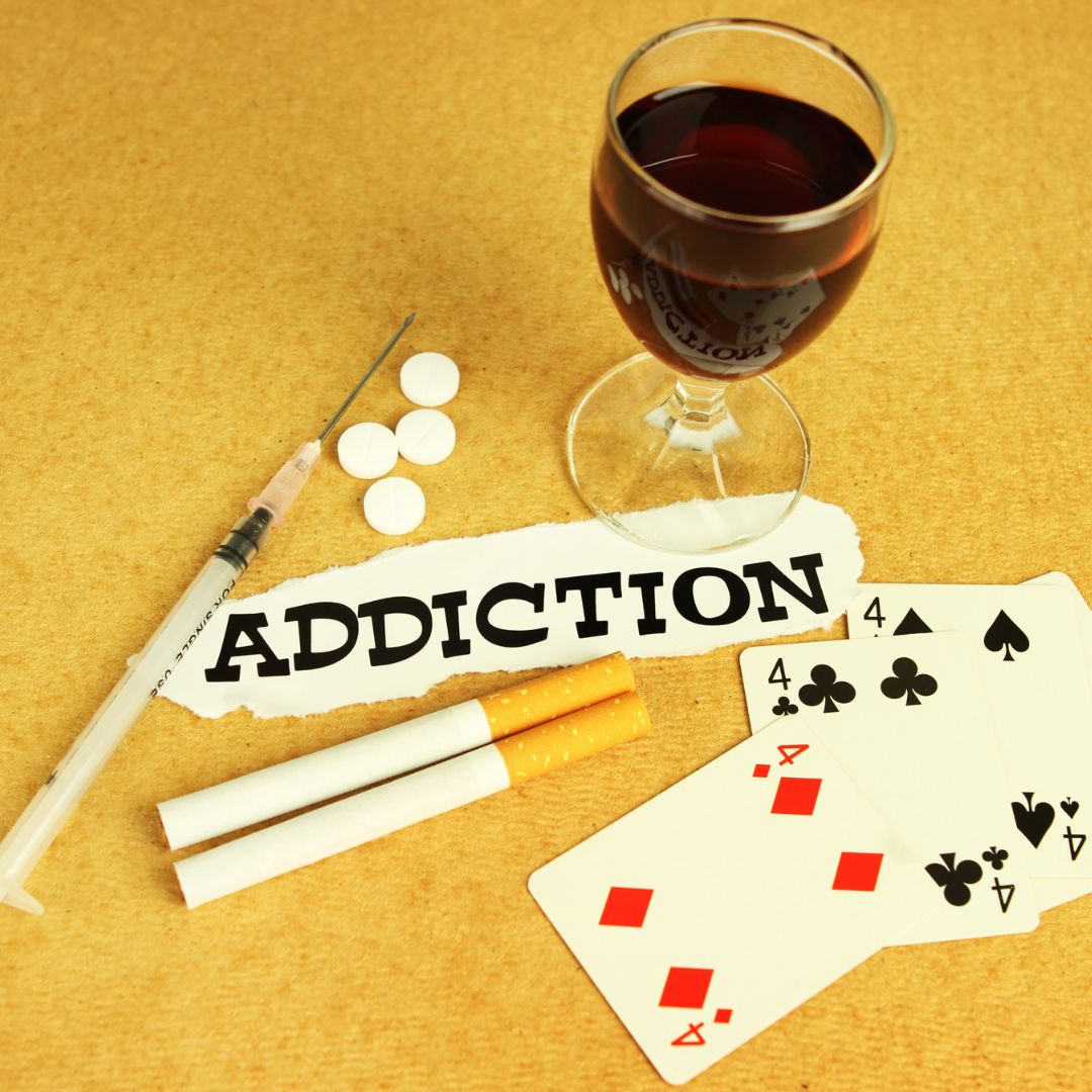 A glass of wine next to the word addiction.